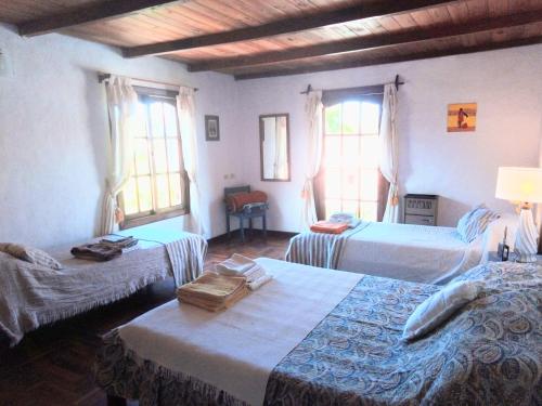 Una cama o camas en una habitación de Chalet Caserón de Tejas