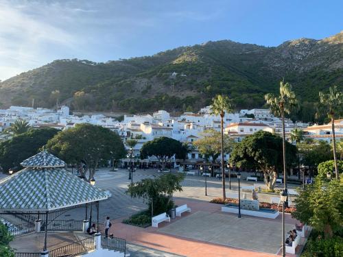 a town with white buildings and a mountain at Casa Carolina - This One in Higuerón with Quality and Peace in Mijas