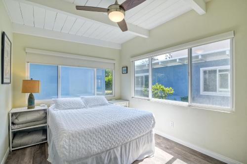 a white bedroom with a bed and a window at Oceanfront Villa with Private Beach Access, Remodeled Kitchen in Carlsbad