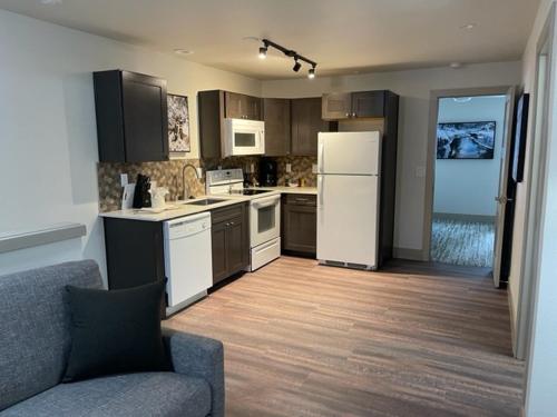 a kitchen with a white refrigerator and wooden floors at Tahoe Trail Resort in Stateline