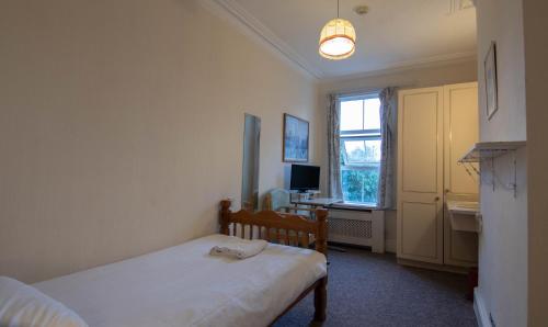 Ένα ή περισσότερα κρεβάτια σε δωμάτιο στο Shelford Lodge