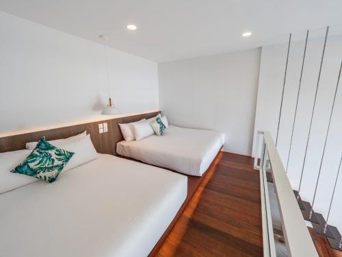 Ένα ή περισσότερα κρεβάτια σε δωμάτιο στο Ease Me Residence