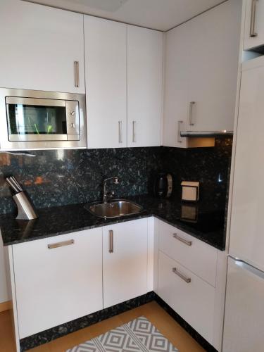 Kuchyň nebo kuchyňský kout v ubytování Apartamento Sanxenxo Carles Deluxe Ocean View