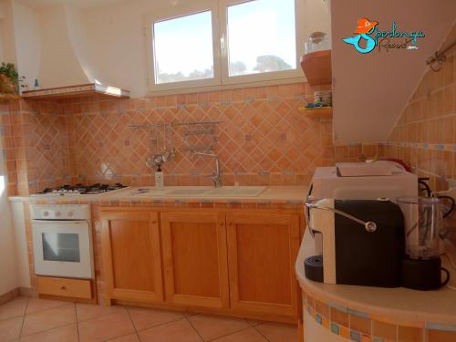 Virtuvė arba virtuvėlė apgyvendinimo įstaigoje Casa Linda Sperlongaresort