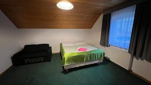 Una cama o camas en una habitación de Willa Larysa Agro