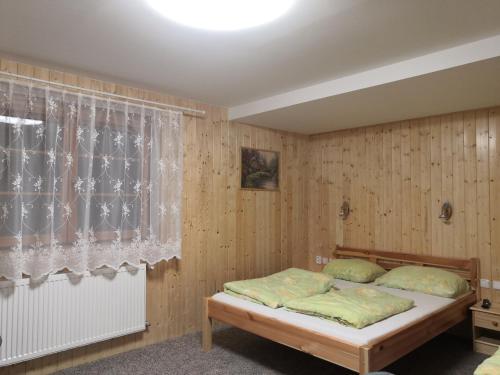 Posteľ alebo postele v izbe v ubytovaní Apartmán ŠUMAVA