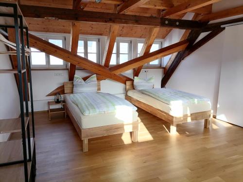 מיטה או מיטות בחדר ב-Ferienwohnung "Am Oberen Tor"