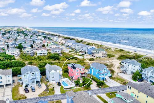 an aerial view of a beach with houses and the ocean at Shared Dreams OS23 in Corolla