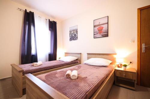 Posteľ alebo postele v izbe v ubytovaní Villa Levatinka