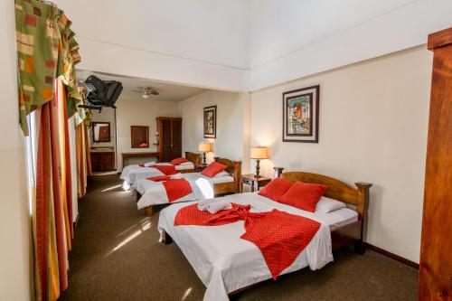 Postel nebo postele na pokoji v ubytování Hotel Amón Real Costa Rica