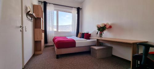 Postel nebo postele na pokoji v ubytování APARTMENT WILD - im Skigebiet Gerlitzen & Ossiacher See