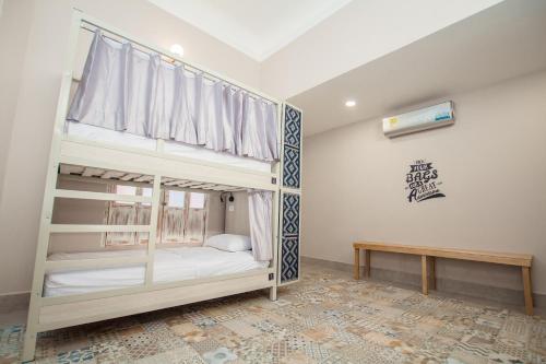 Katil atau katil-katil dalam bilik di Casa Avelina Boutique Hostel