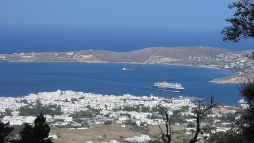 a cruise ship in a large body of water at Paros Apartments Cottage in Parikia