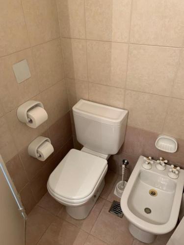 a small bathroom with a toilet and a sink at RECOLETA STUDIO in Buenos Aires
