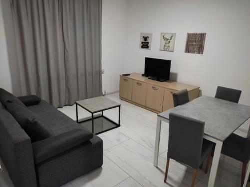 Televízia a/alebo spoločenská miestnosť v ubytovaní New Apartments