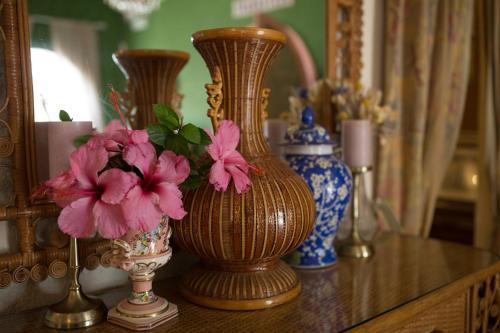 a group of vases sitting on a table with flowers at El Cid Country Club in Benidoleig