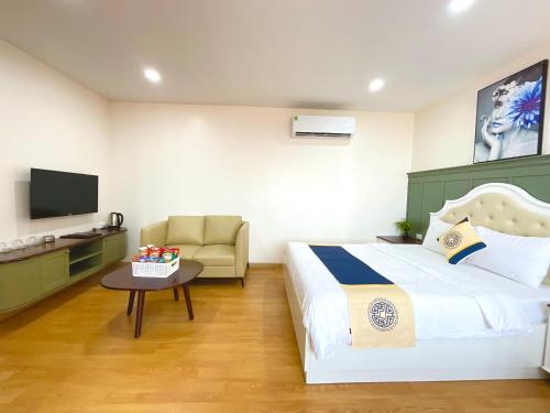 Giường trong phòng chung tại Khải Hoàn Hotel 2