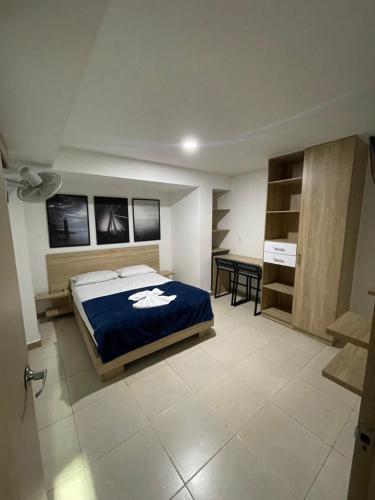 Postel nebo postele na pokoji v ubytování HOTEL MEDELLIN CENTRAL