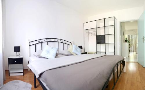 Posteľ alebo postele v izbe v ubytovaní Apartment ADAM