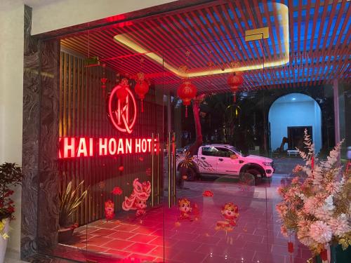a store front with a red sign on the door at Khải Hoàn Hotel 2 in Bến Cát