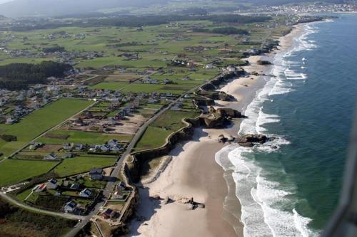 an aerial view of a beach and the ocean at Casa do Merlo in Barreiros