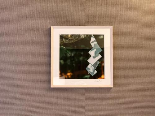 a picture on a wall with a white frame at yoin hotel kyoto gion in Kyoto
