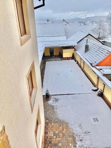an aerial view of a building with snow covered roofs at La Mimi Villa in Sadu