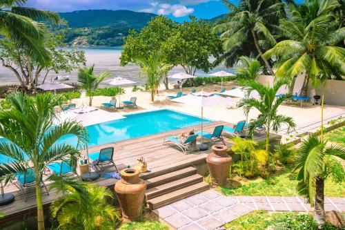 an aerial view of the pool at the resort at Pineapple Beach Villas in Baie Lazare Mahé
