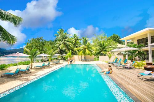 a pool at the resort at Pineapple Beach Villas in Baie Lazare Mahé