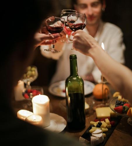 a group of people sitting at a table with wine glasses at Mintaro Hideaway in Mintaro