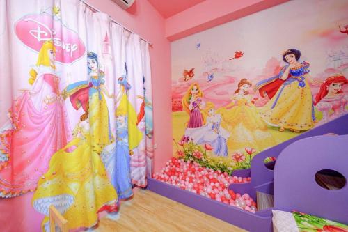 a room with a disney princess mural on the wall at Han Tian Tongyu in Wujie