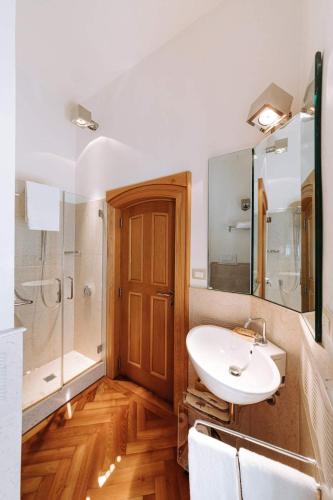 a bathroom with a sink and a shower at Santa Rosa Relais in Noci