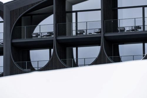 an external view of a building with balconies at Hotel Milla Montis in Maranza