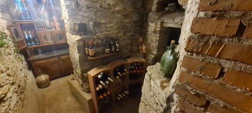 a room with a bunch of bottles on a wall at Apartmány Tollendorf Lužické hory in Jiřetín pod Jedlovou