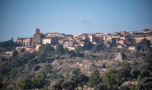 a city on top of a hill with houses at Casa La morera del Montsant in La Morera de Montsant