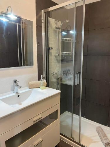 a bathroom with a shower and a sink and a shower at MiRA MAR in Lajita