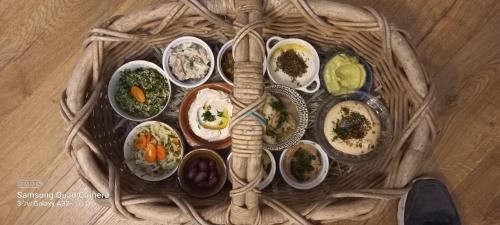 a table topped with different types of food in bowls at קטלב kta-love in Kammon