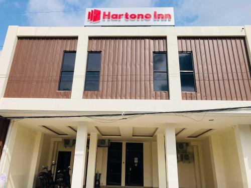 a large building with a hamboo inn sign on it at Hartono Inn Seturan Mitra RedDoorz in Seturan