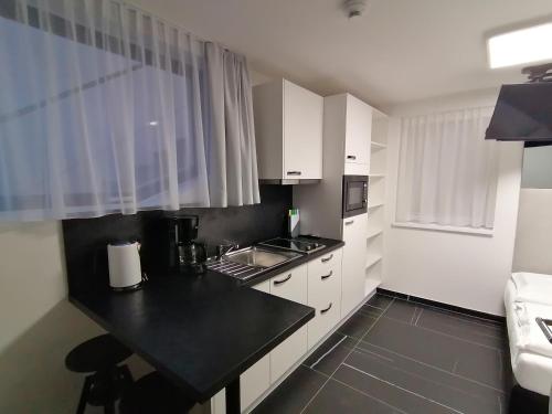Кухня или мини-кухня в The Place Boutique & Design Hotel Flachau
