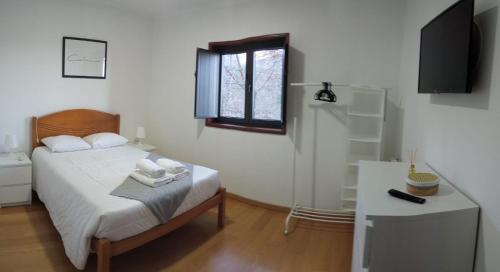 Een bed of bedden in een kamer bij Casa Da Ameixieira