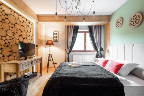 Posteľ alebo postele v izbe v ubytovaní Apartament Natura Zakopane