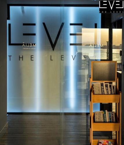 a sign on a glass wall in a store at Melia Alicante in Alicante