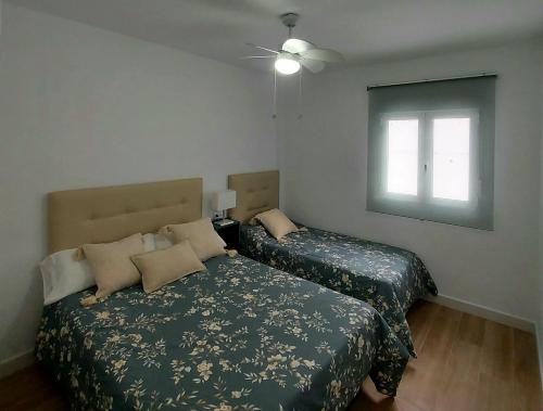 Cama o camas de una habitación en Casa Rural Benamahoma