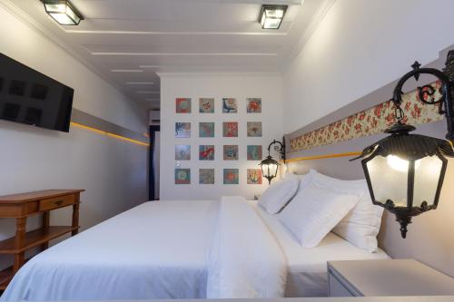 Ein Bett oder Betten in einem Zimmer der Unterkunft Pousada Aconchego