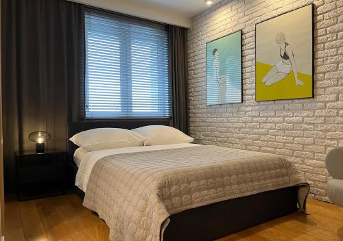 Łóżko lub łóżka w pokoju w obiekcie Apartamenty Modern Gdynia