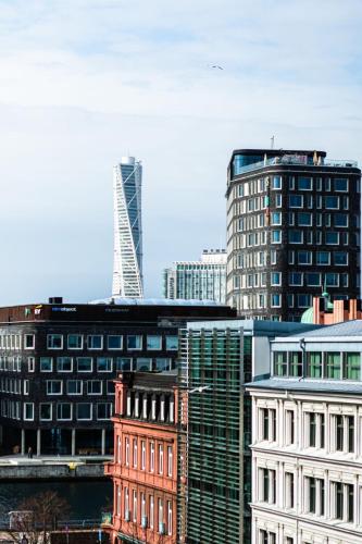 a group of tall buildings in a city at First Hotel Jörgen Kock in Malmö