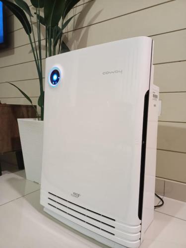 a white refrigerator sitting on top of a counter at As Syifaa Homestay Mslim only in Ipoh