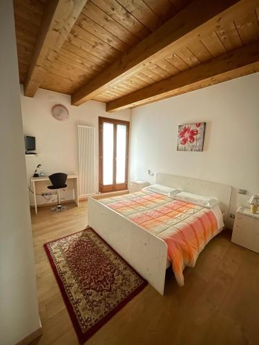 Tempat tidur dalam kamar di La Casa del Sogno