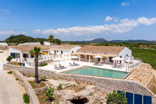 an aerial view of a house with a swimming pool at Agroturismo Llucasaldent Gran Menorca - Adults Only in Son Bou