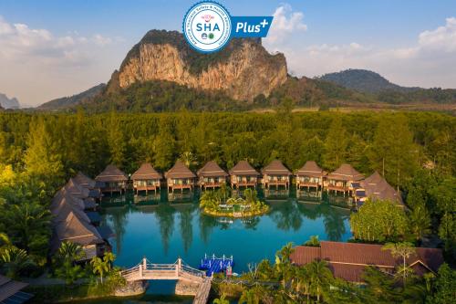 an aerial view of the resort with a mountain in the background at Poonsiri Resort Aonang-SHA Extra Plus in Ao Nang Beach